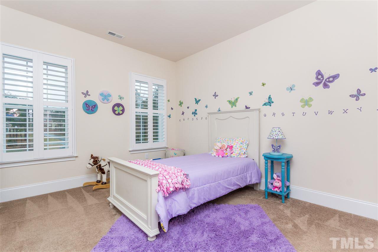 4600 Fielding Drive Raleigh, NC 27606 - Photo 20 of 25 a bedroom with a bed and a window