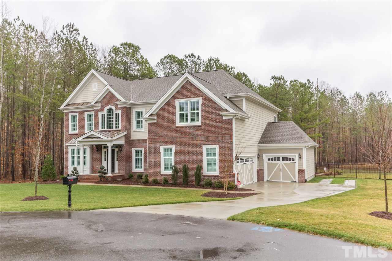 4600 Fielding Drive Raleigh, NC 27606 - Photo 3 of 25 a front view of a house with a garden and trees