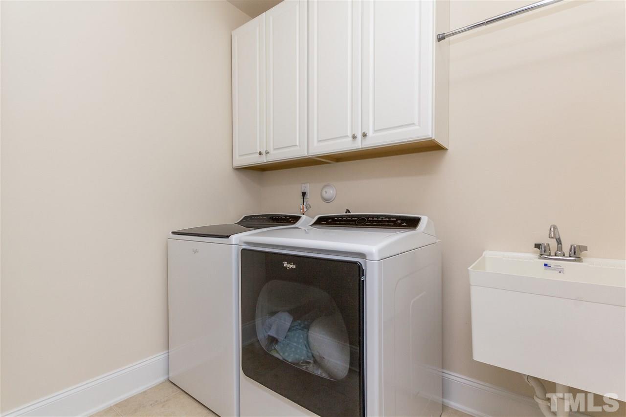 4600 Fielding Drive Raleigh, NC 27606 - Photo 23 of 25 a utility room with dryer and washer