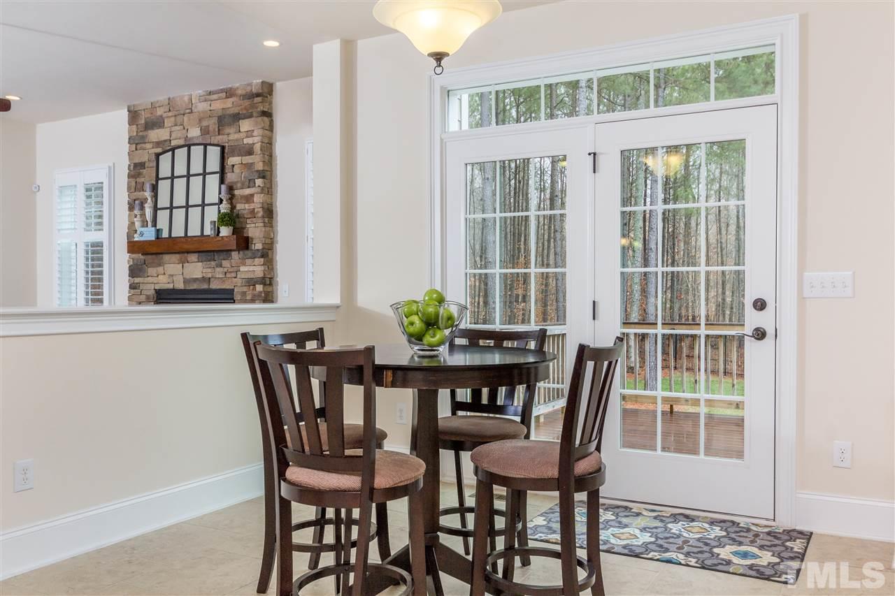 4600 Fielding Drive Raleigh, NC 27606 - Photo 8 of 25 a view of a dining room with furniture and window