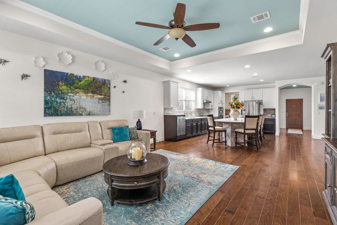 706 Kite Ridge Street Georgetown, TX 78633 - Photo 34 of 36 a living room with furniture and wooden floor