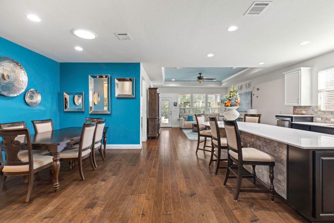 706 Kite Ridge Street Georgetown, TX 78633 - Photo 33 of 36 a view of a dining area with furniture and wooden floor