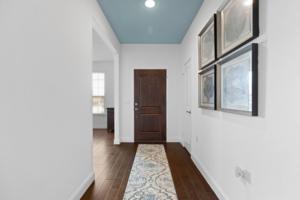 706 Kite Ridge Street Georgetown, TX 78633 - Photo 18 of 36 a view of hallway with wooden floor