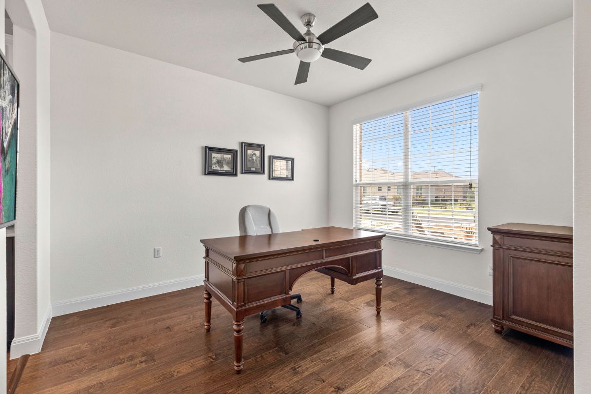 706 Kite Ridge Street Georgetown, TX 78633 - Photo 19 of 36 a view of a workspace with furniture and a window