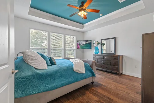 a view of hallway with wooden floor