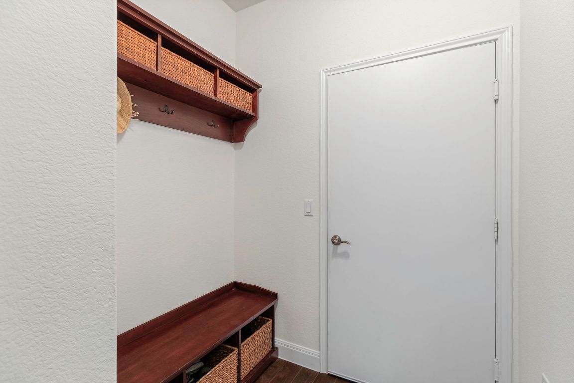 706 Kite Ridge Street Georgetown, TX 78633 - Photo 27 of 36 a room with a bench