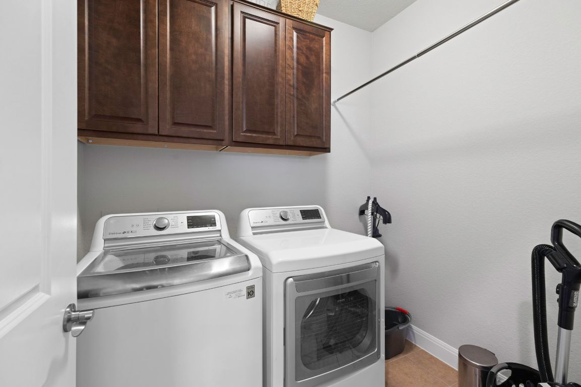 706 Kite Ridge Street Georgetown, TX 78633 - Photo 28 of 36 a utility room with dryer and washer