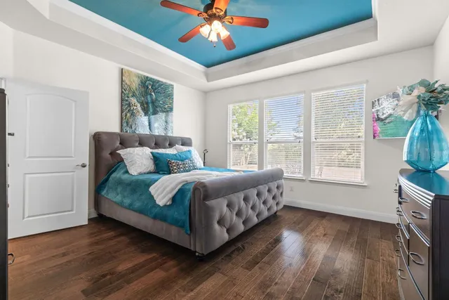 a kitchen with refrigerator and chairs