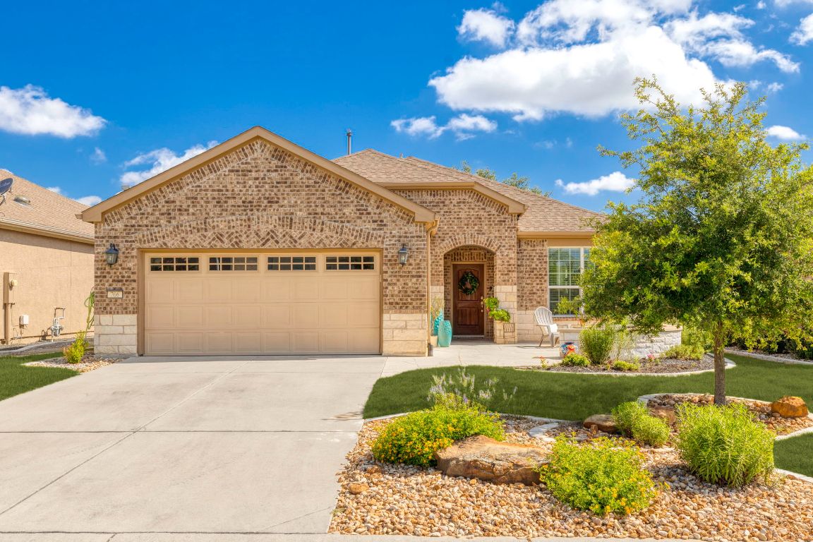 706 Kite Ridge Street Georgetown, TX 78633 - Photo 6 of 36 a front view of a house with a yard and garage