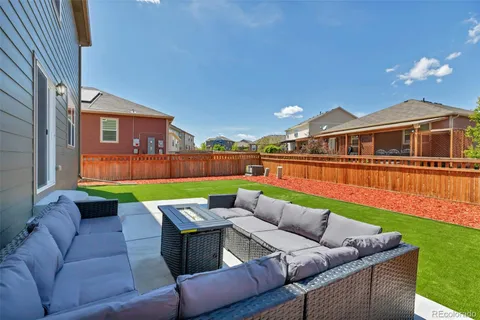 a patio with patio a couch and chairs