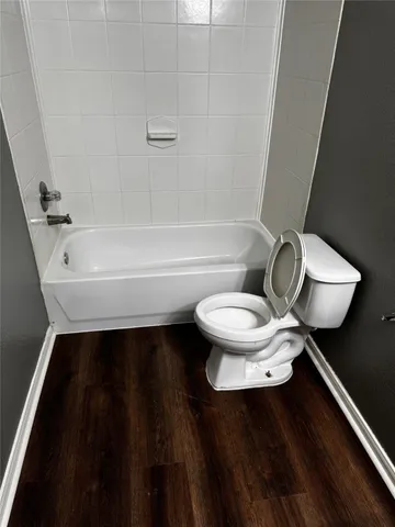 a bathroom with a sink a toilet a vanity and mirror