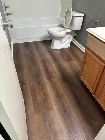 a bathroom with a toilet and a sink