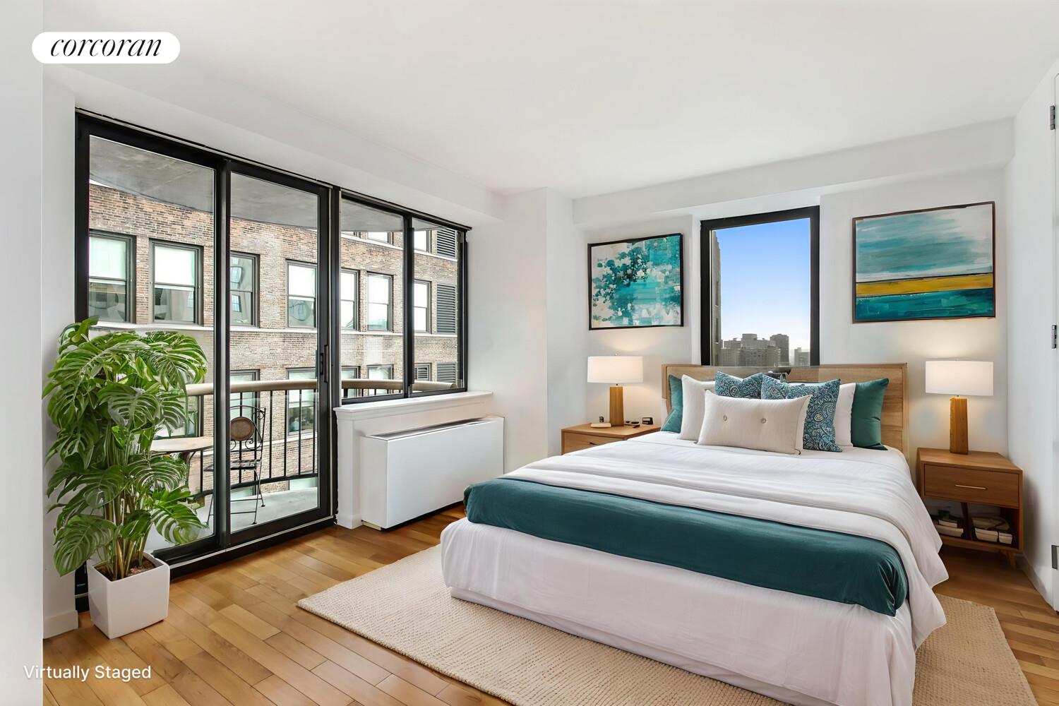 45 East 25th Street, Unit 27C Manhattan, NY 10010 - Photo 7 of 9 a bedroom with a large bed and a large window