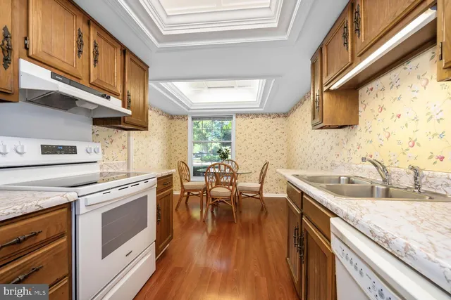 a white toilet sitting next to a bath tub
