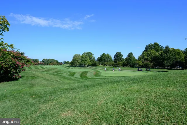 a view of an empty room with a fireplace