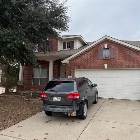 a car parked in front of a house