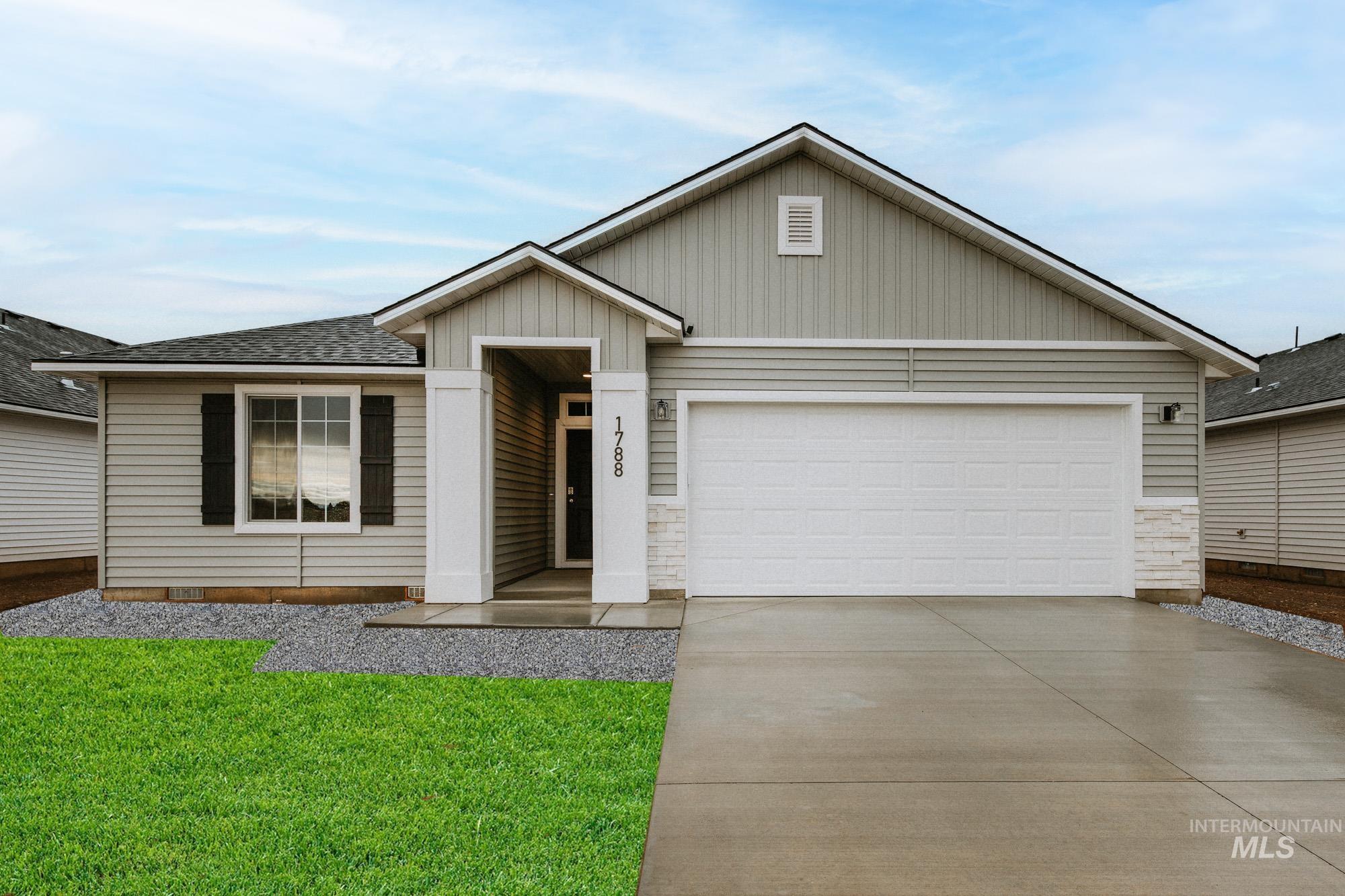 1788 West Unforgettable Street Meridian, ID 83642 - Photo 1 of 1 Ranch-style house featuring driveway, a front yard, an attached garage, board and batten siding, and roof with shingles