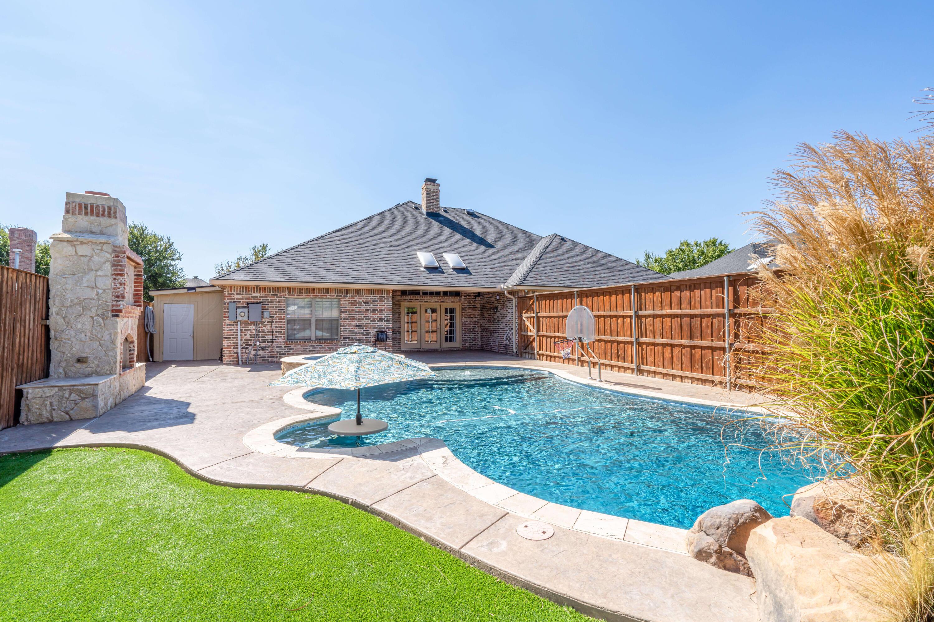 7606 Bayswater Road Amarillo, TX 79119 - Photo 11 of 65 a front view of a house with a yard