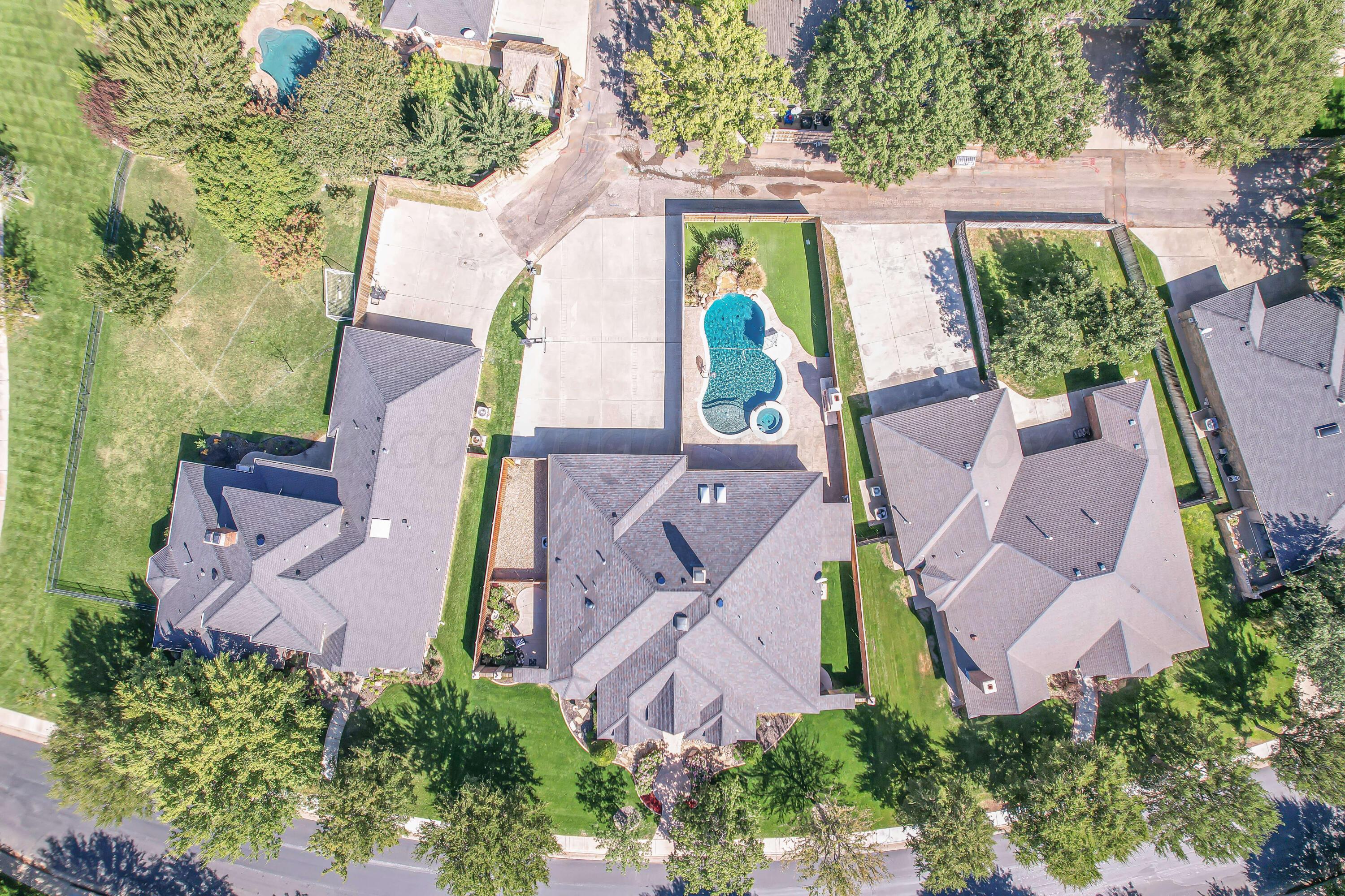 7606 Bayswater Road Amarillo, TX 79119 - Photo 18 of 65 an aerial view of a house with swimming pool and garden