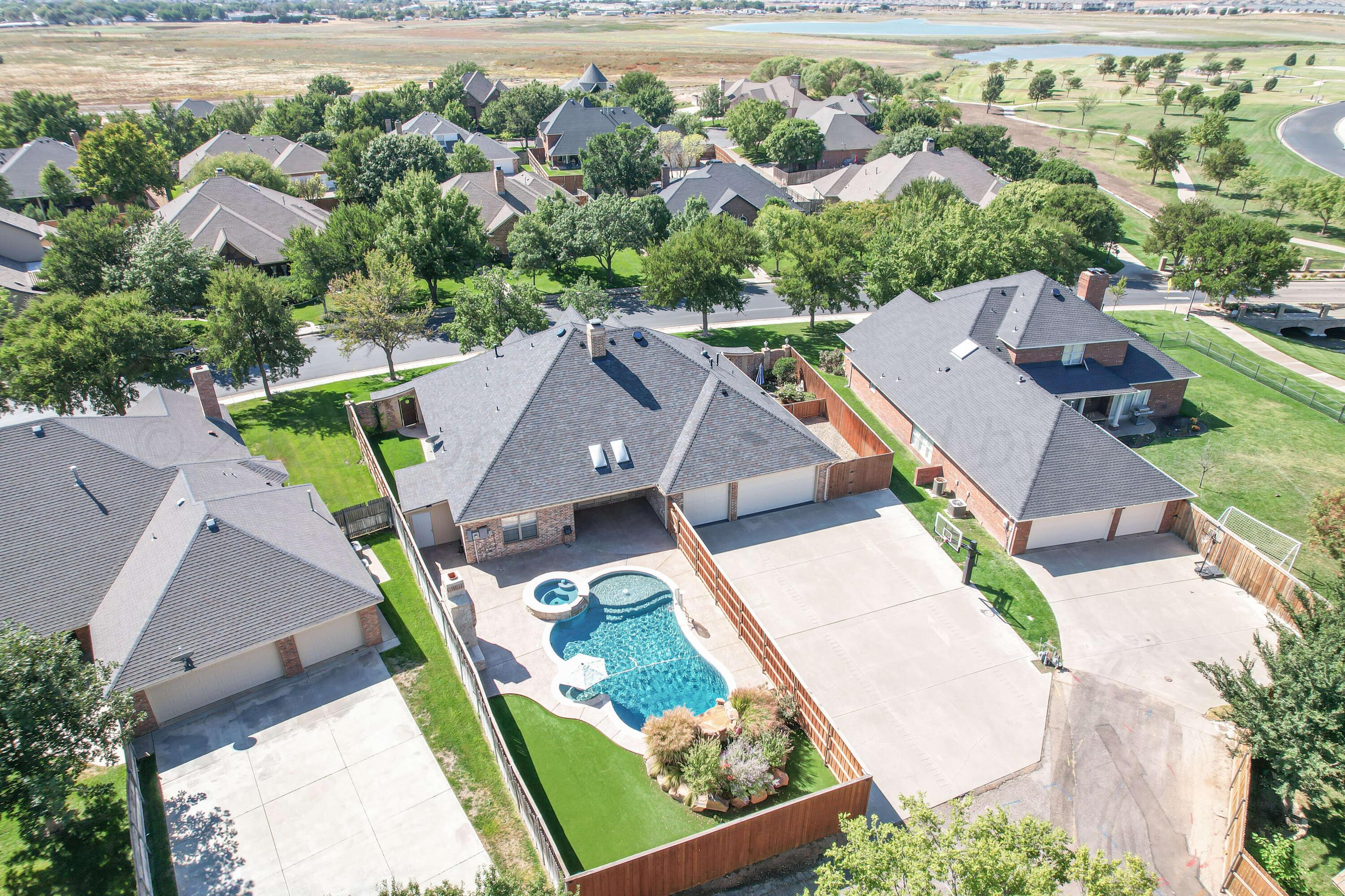 7606 Bayswater Road Amarillo, TX 79119 - Photo 19 of 65 an aerial view of a house with a yard