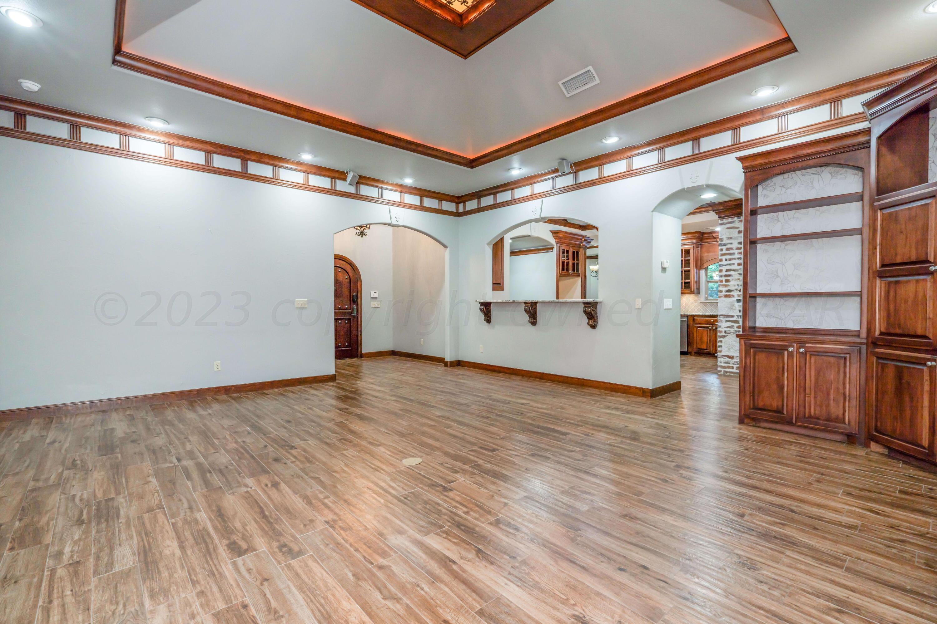 7606 Bayswater Road Amarillo, TX 79119 - Photo 24 of 65 a view of a room with wooden floor