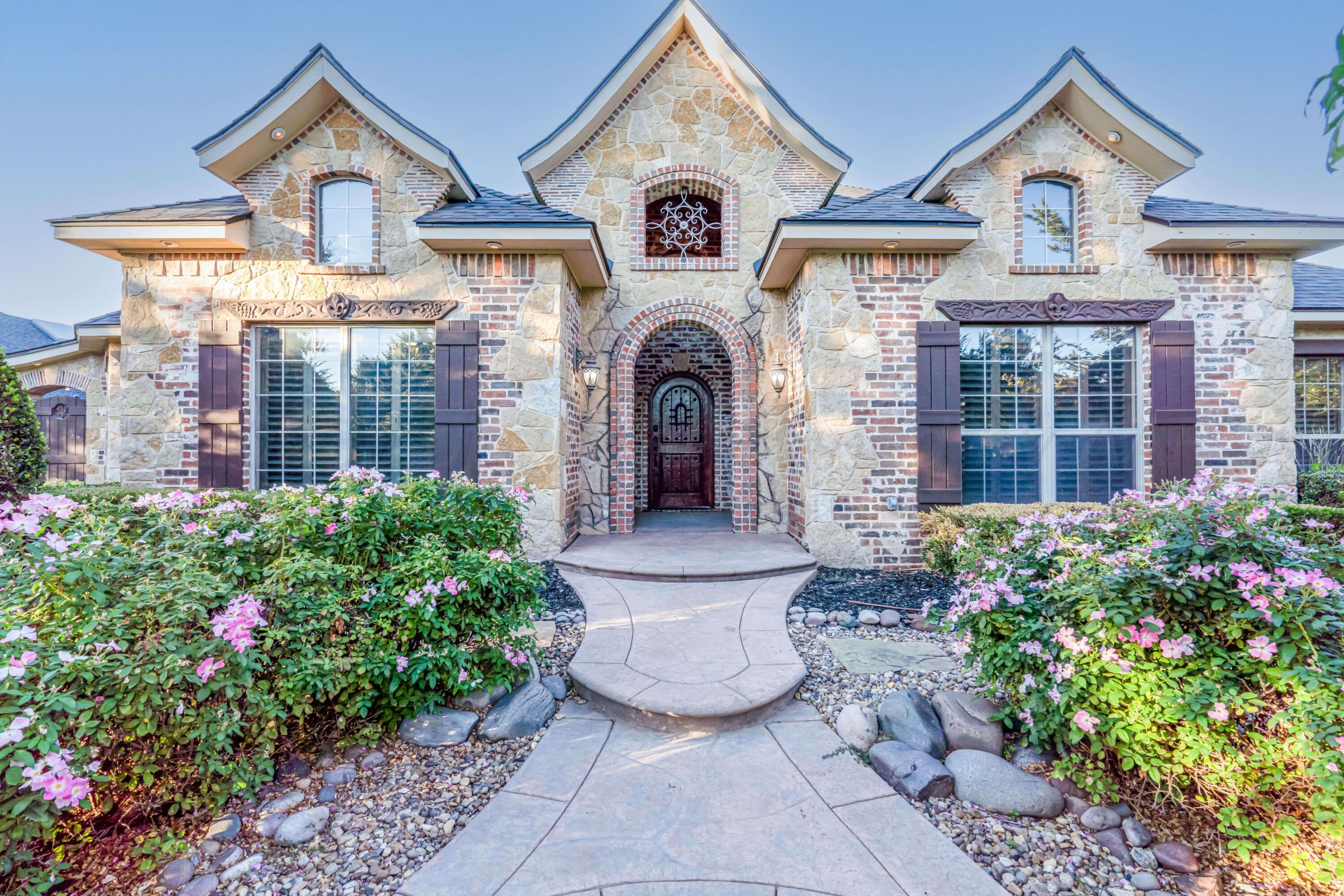 7606 Bayswater Road Amarillo, TX 79119 - Photo 3 of 65 a front view of a house with garden