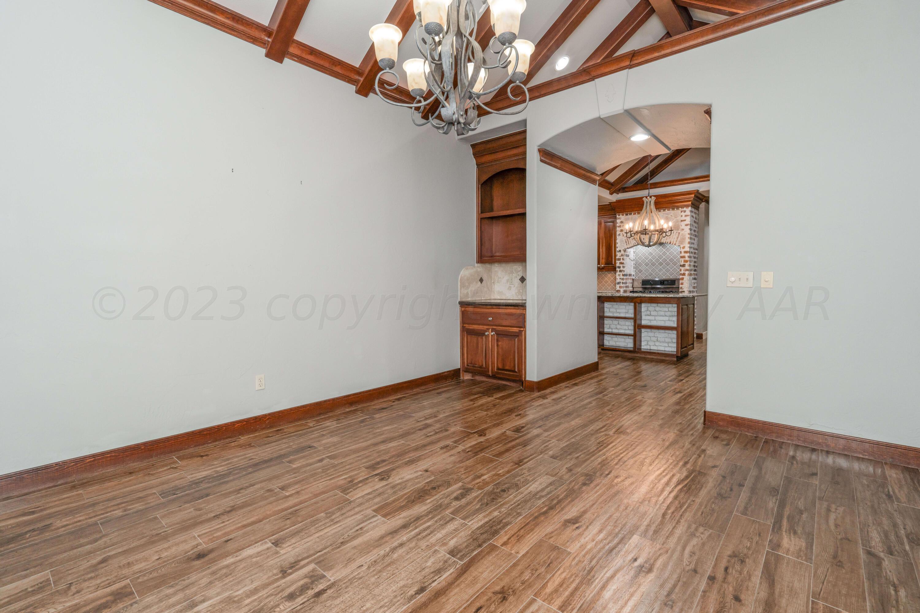 7606 Bayswater Road Amarillo, TX 79119 - Photo 41 of 65 a view of empty room with wooden floor