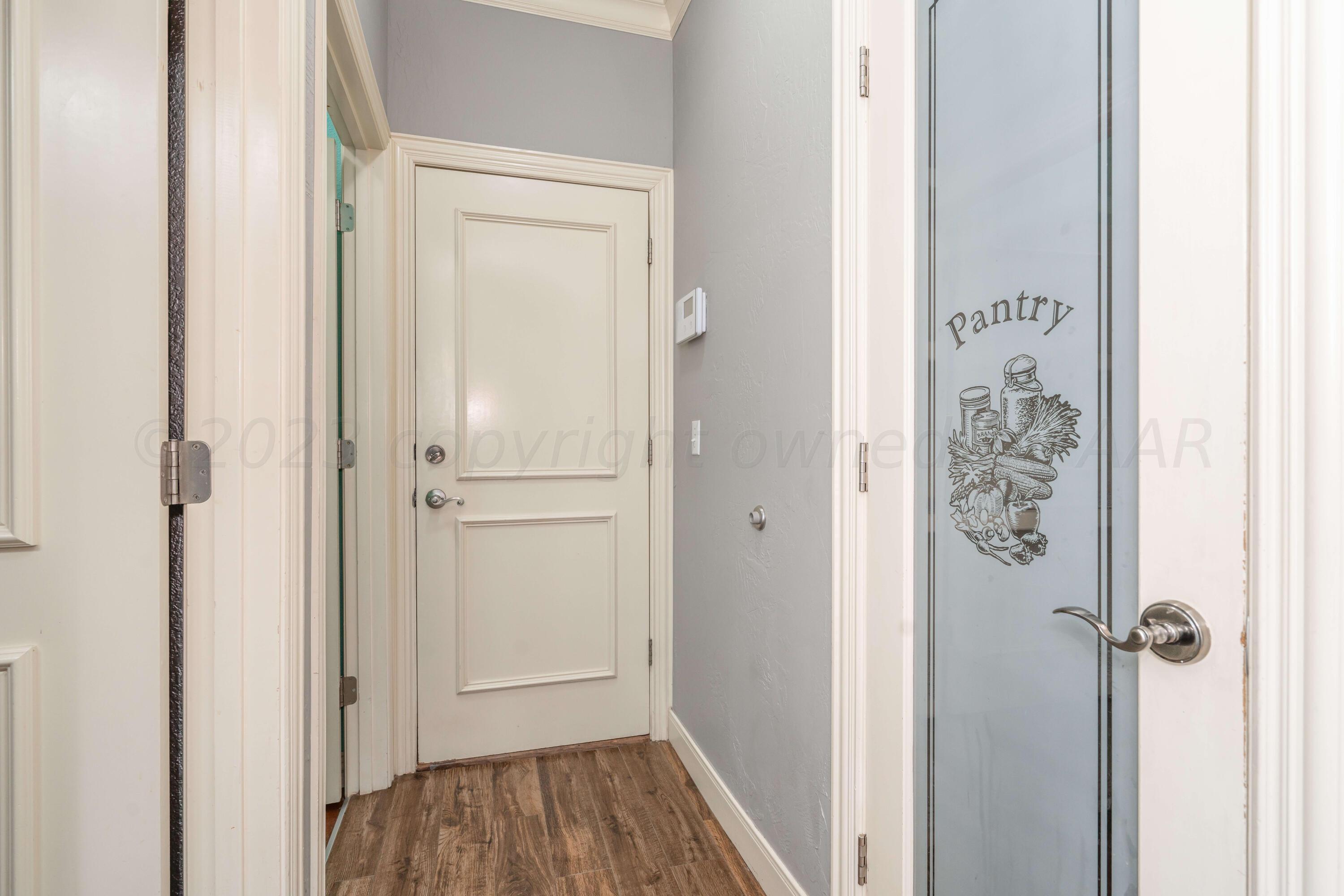 7606 Bayswater Road Amarillo, TX 79119 - Photo 42 of 65 a view of a hallway with wooden floor