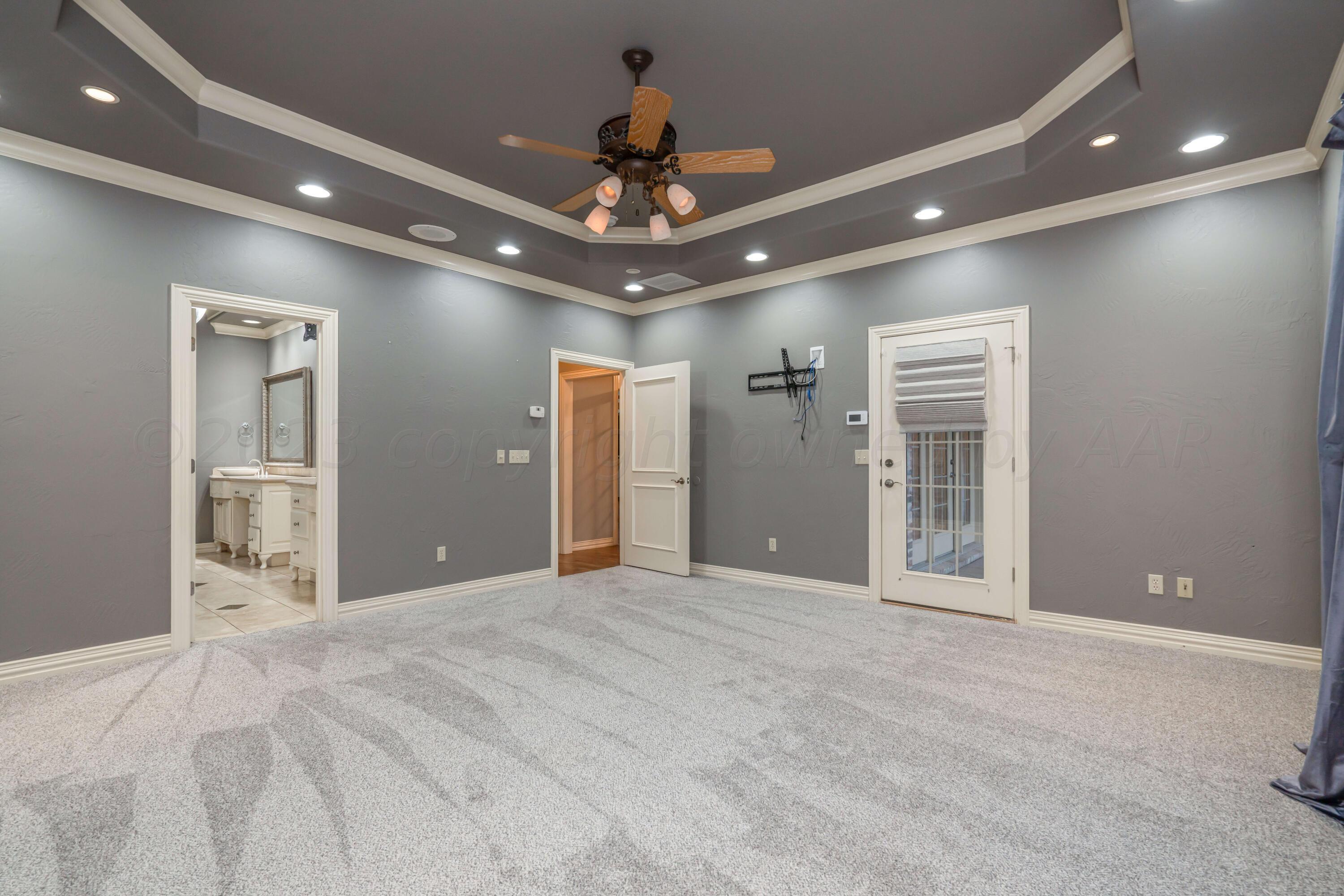 7606 Bayswater Road Amarillo, TX 79119 - Photo 46 of 65 a view of an empty room with a chandelier