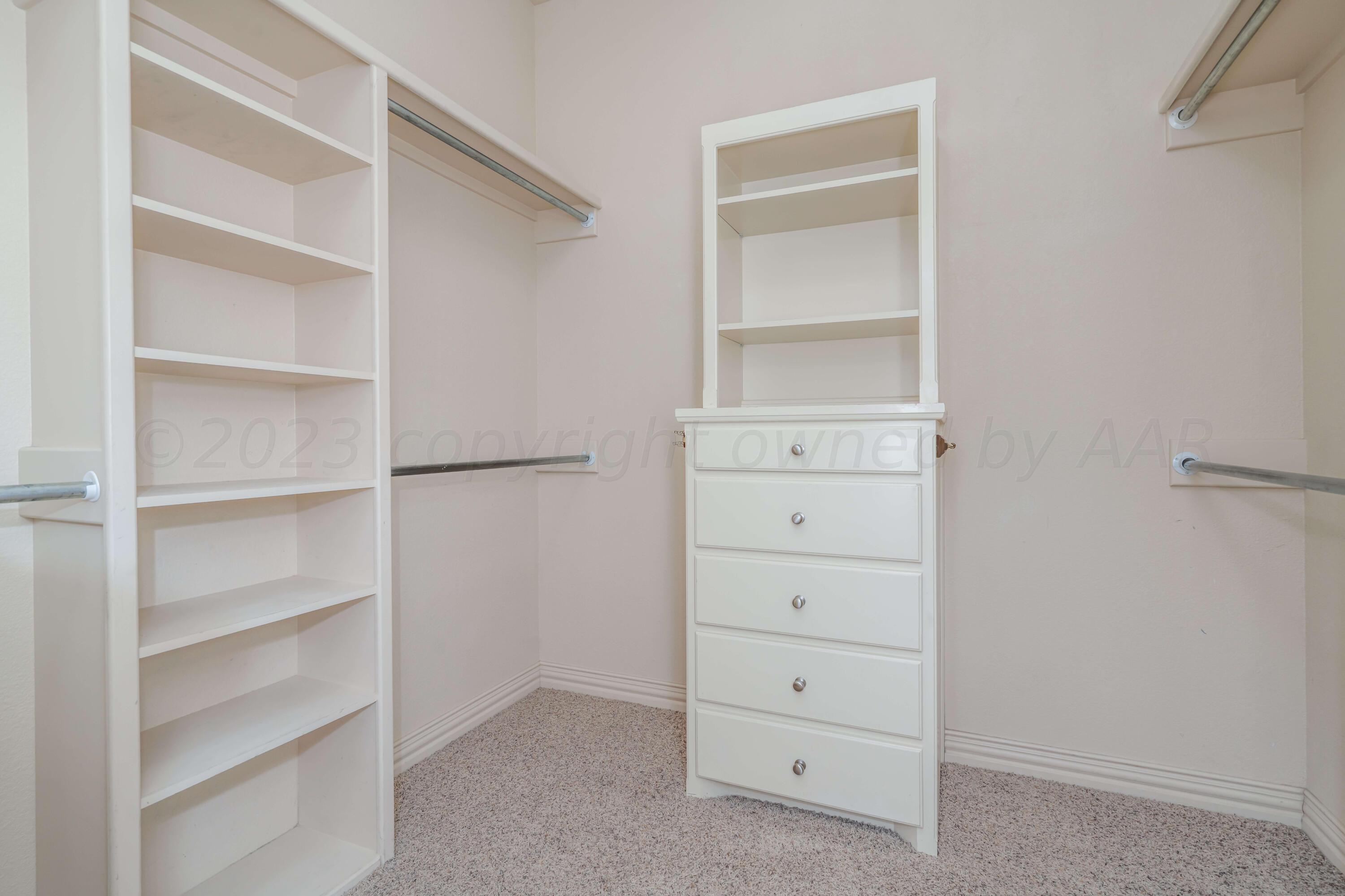 7606 Bayswater Road Amarillo, TX 79119 - Photo 53 of 65 a view of an empty walk in closet