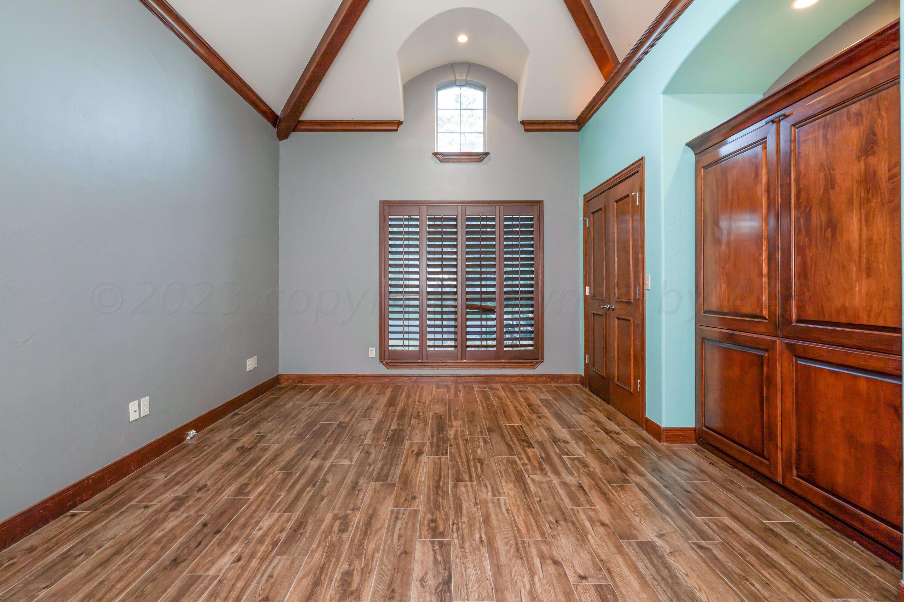 7606 Bayswater Road Amarillo, TX 79119 - Photo 56 of 65 a view of empty room with wooden floor and fan