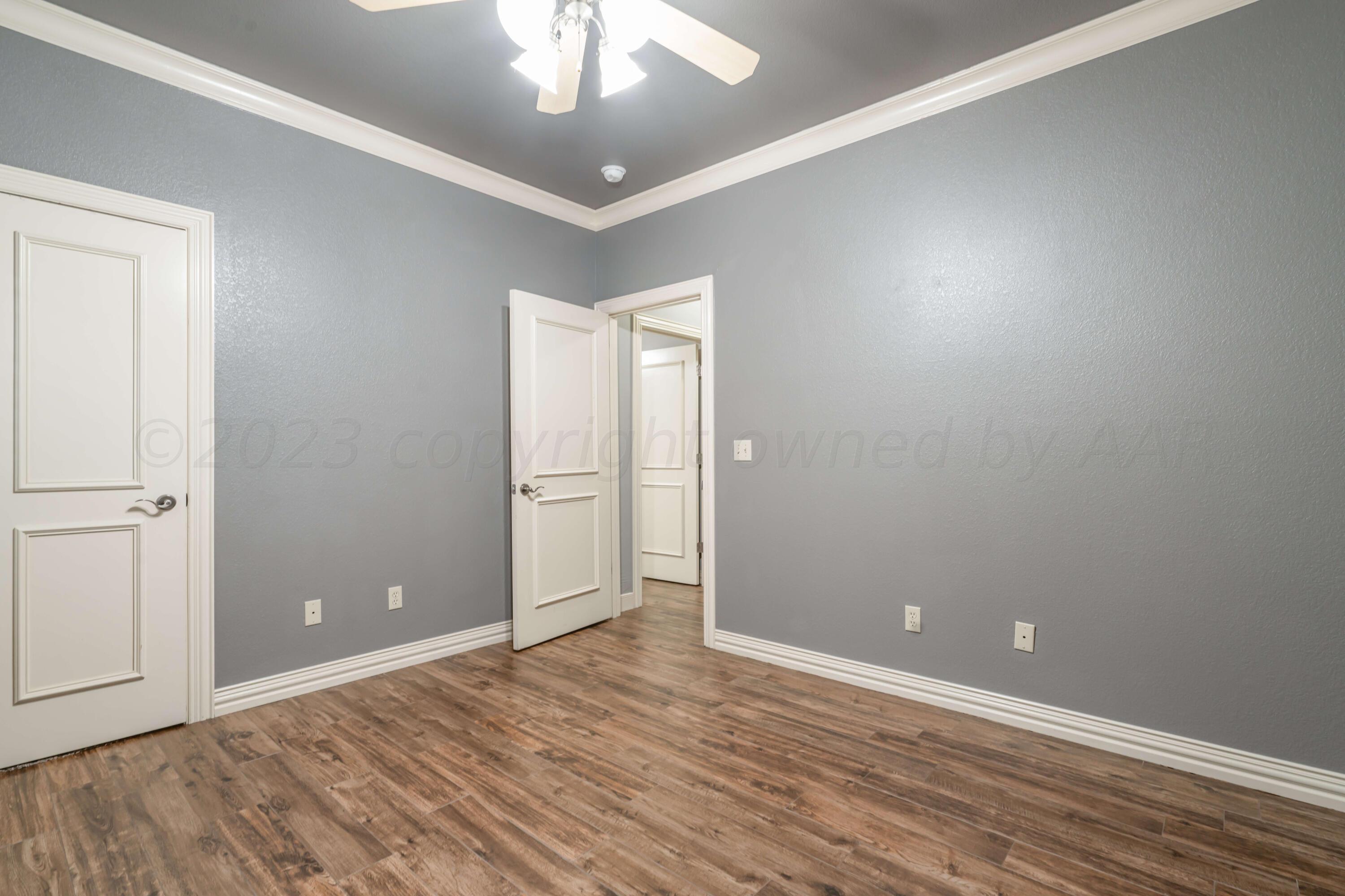 7606 Bayswater Road Amarillo, TX 79119 - Photo 63 of 65 wooden floor in an empty room
