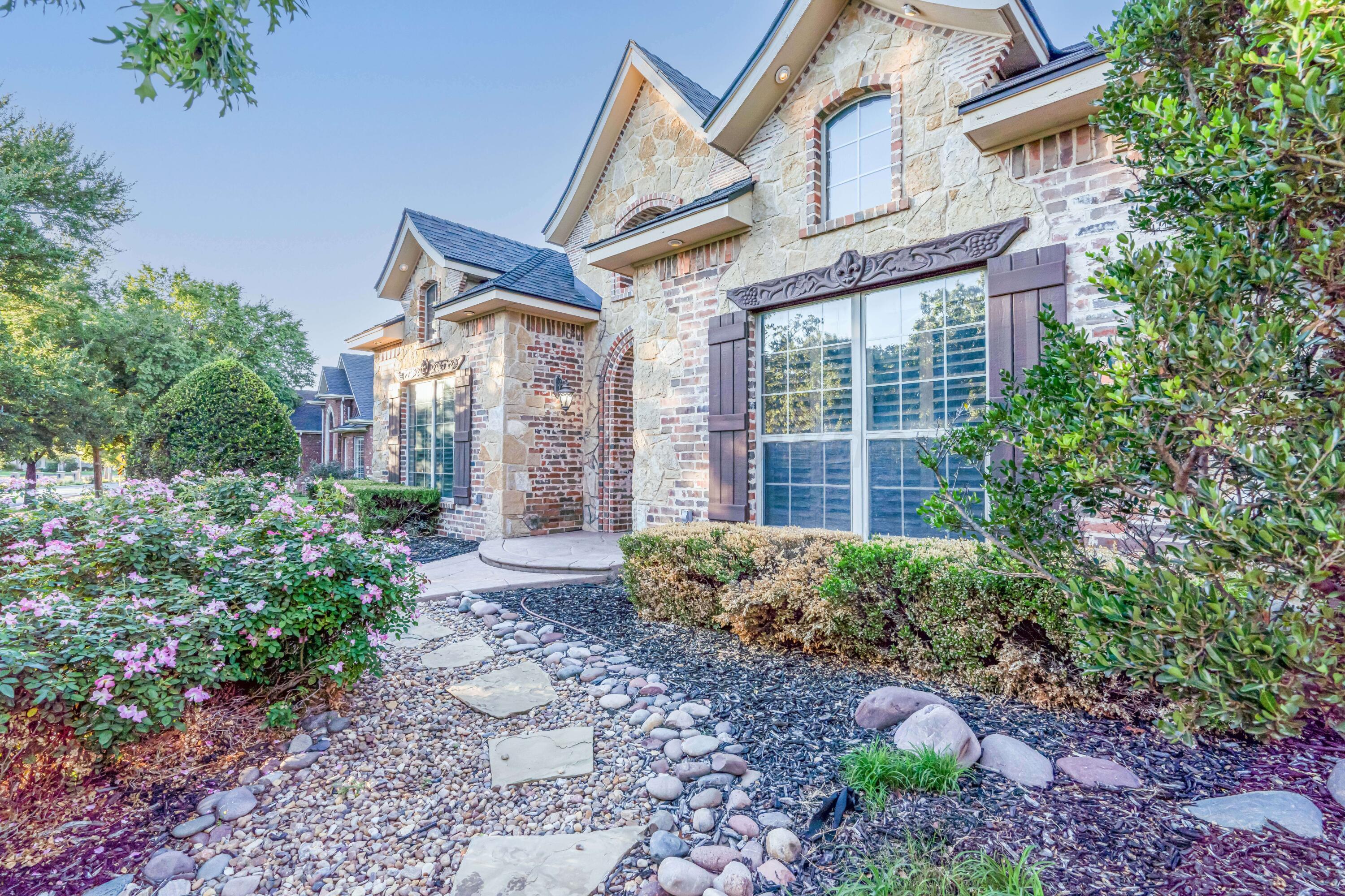 7606 Bayswater Road Amarillo, TX 79119 - Photo 7 of 65 a front view of a house with garden