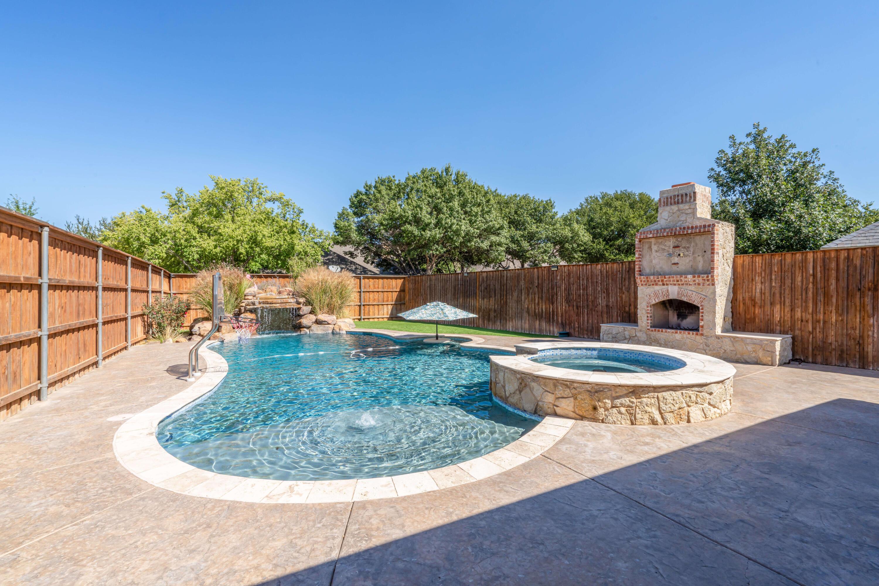 7606 Bayswater Road Amarillo, TX 79119 - Photo 8 of 65 a view of a swimming pool with a patio