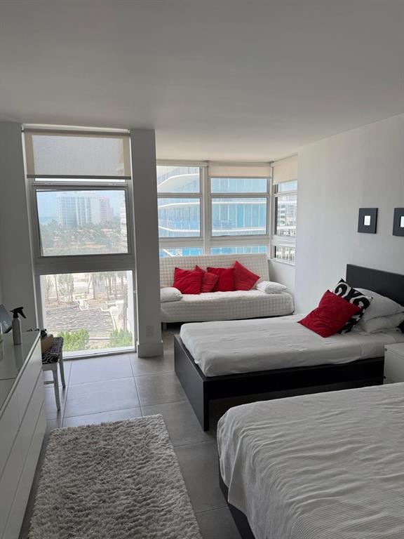 1370 South Ocean Boulevard, Unit 902 Pompano Beach, FL 33062 - Photo 15 of 21 a bedroom with a bed and window