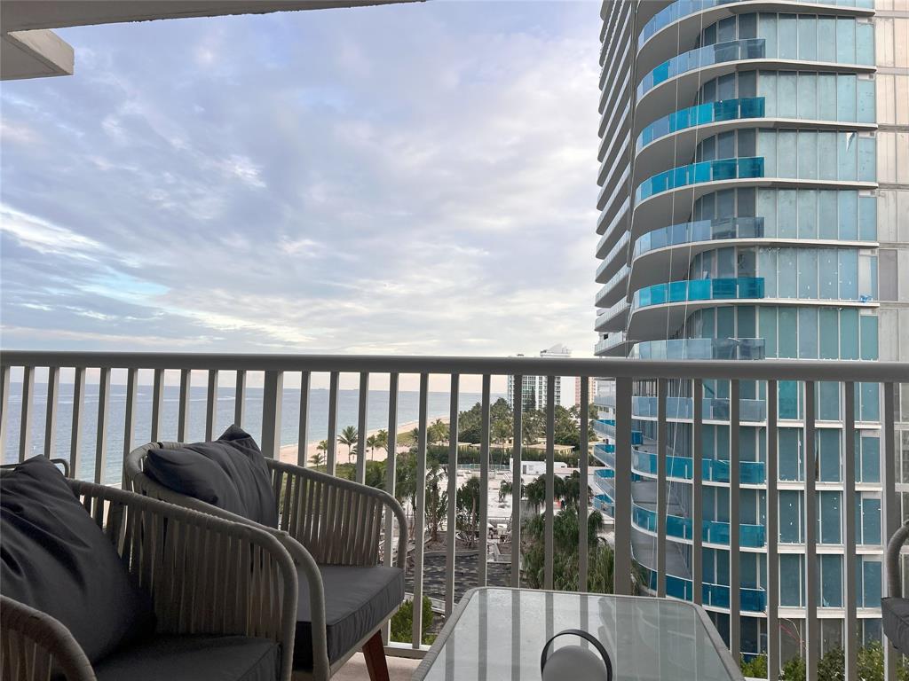 1370 South Ocean Boulevard, Unit 902 Pompano Beach, FL 33062 - Photo 20 of 21 a balcony with table and chairs