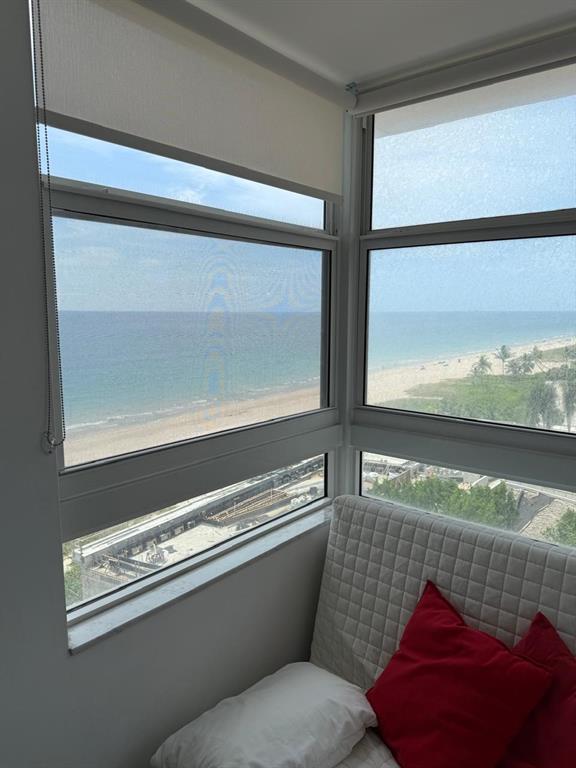 1370 South Ocean Boulevard, Unit 902 Pompano Beach, FL 33062 - Photo 2 of 21 a living room with a couch and a large window