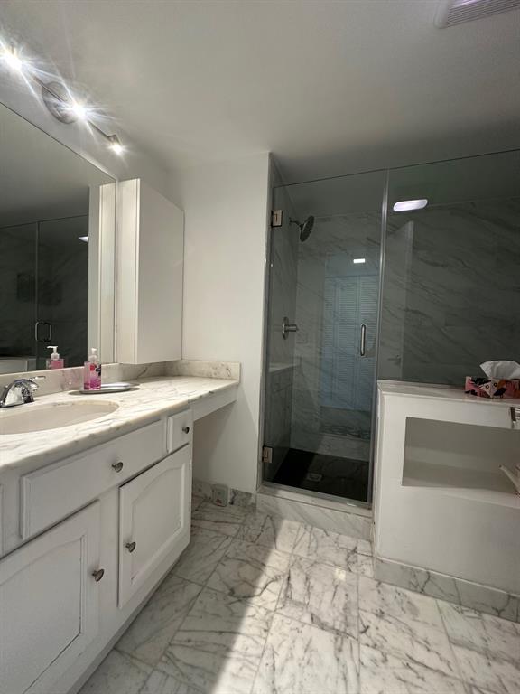1370 South Ocean Boulevard, Unit 902 Pompano Beach, FL 33062 - Photo 5 of 21 a bathroom with a sink a toilet and shower