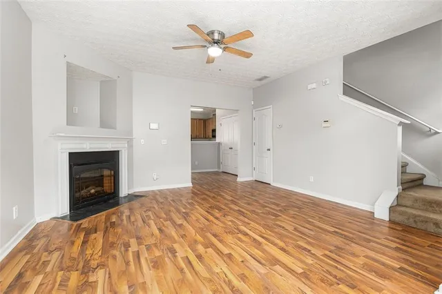 a bedroom with a bed and a fireplace