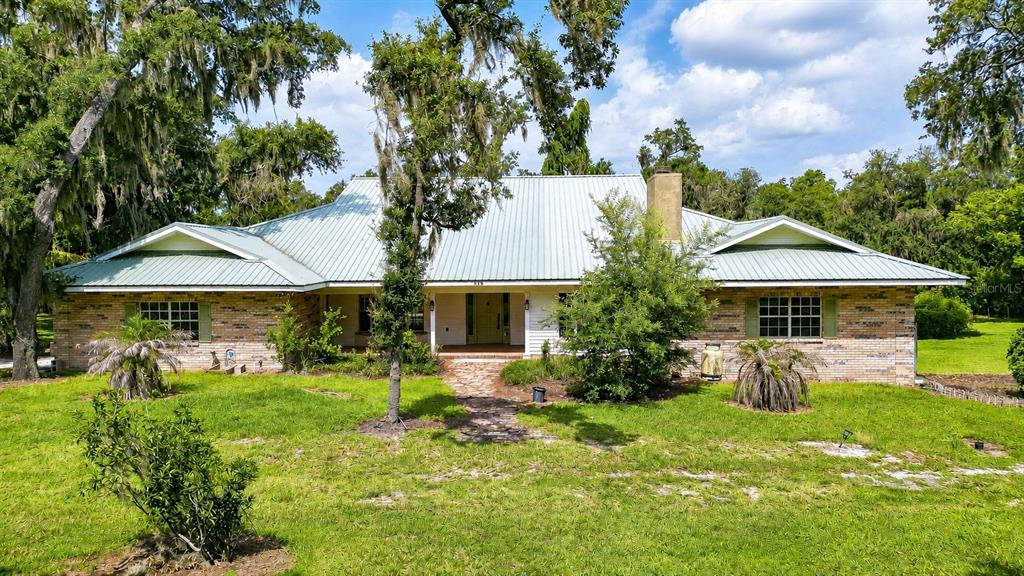 914 South Miller Road Valrico, FL 33594 - Photo 1 of 51 a front view of a house with garden