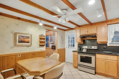 a kitchen with stainless steel appliances a stove a sink dishwasher and cabinets