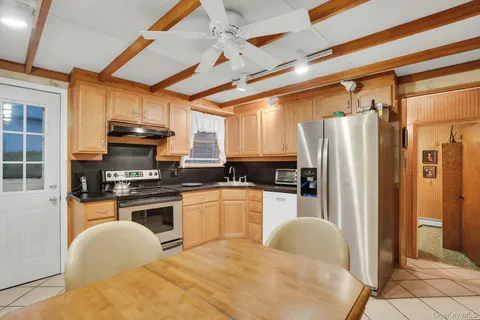 a bathroom with a toilet a sink and garden