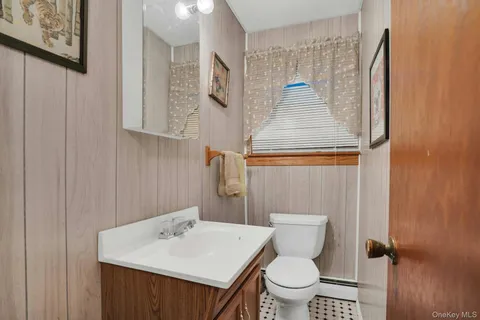 a blue couch sitting in front of a window