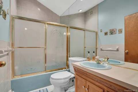 a bedroom with a bed and a table in it