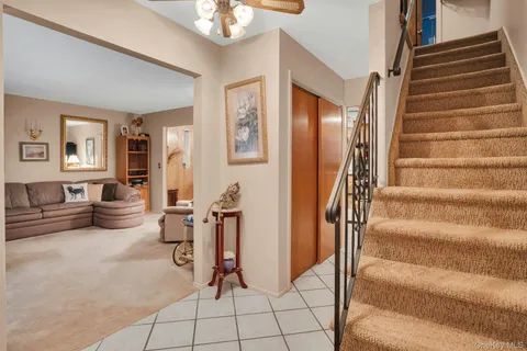 a view of livingroom with furniture and workspace
