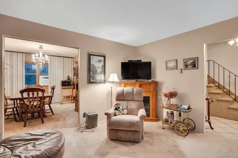 a bedroom with furniture and a flat screen tv