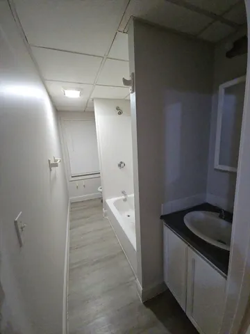 a bathroom with a sink and mirror