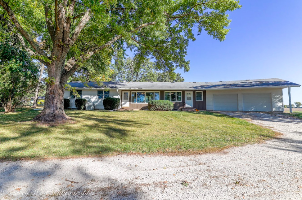 13432 Ash Road Genoa, IL 60135 - Photo 4 of 53 a front view of a house with a yard