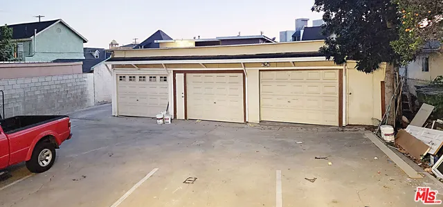 a view of a garage and car parked
