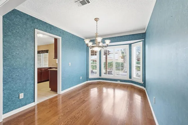 a view of livingroom with natural light and hardwood floor
